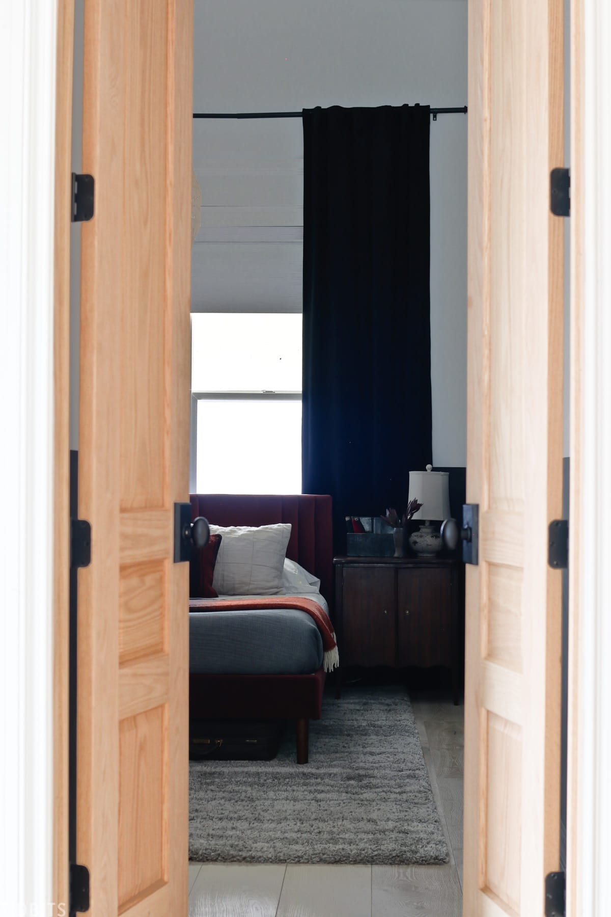 wood oak doors entering into bedroom