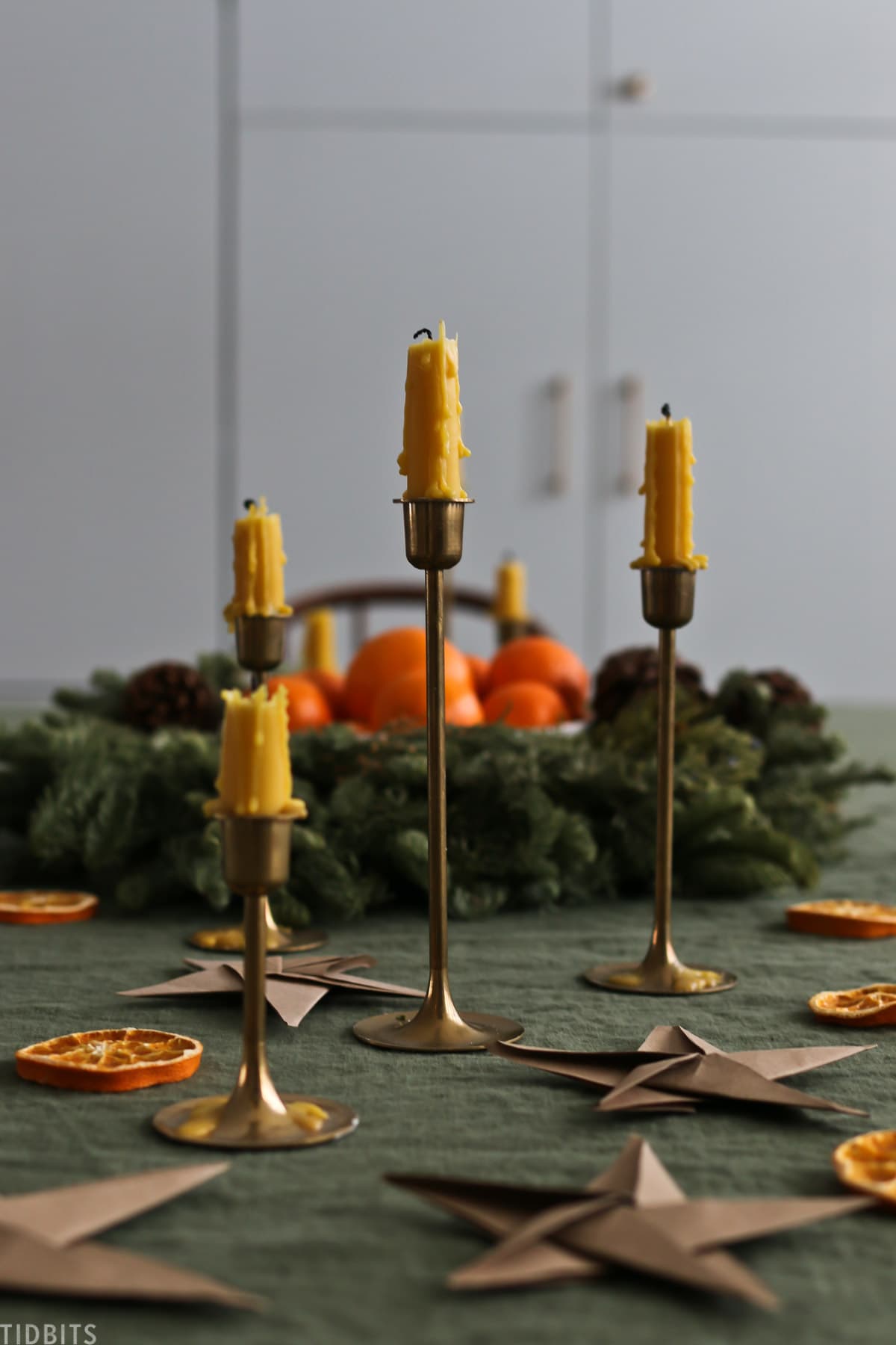 Drippy beeswax candles on a christmas tablescape