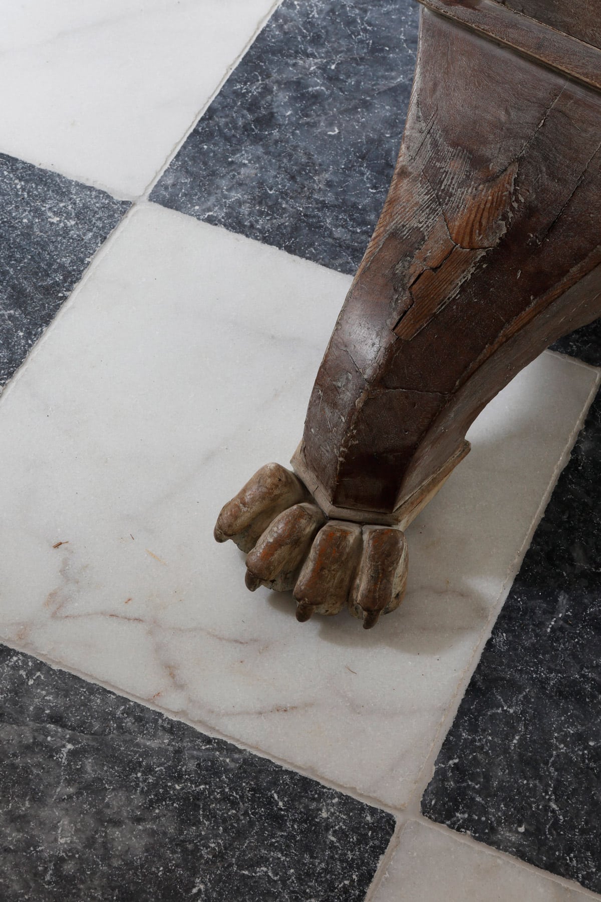 vintage table leg and Carrara marble floor tiles