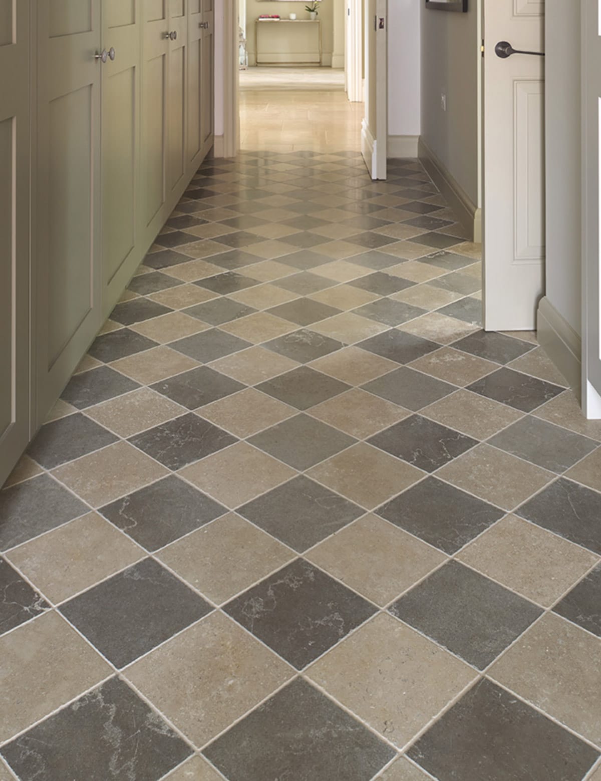 ceramic floor tiles in gray and creamy beige colors in a hallway