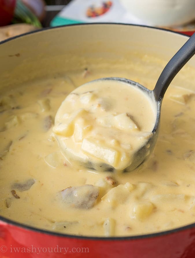 Ladle full of chunky baked potato soup