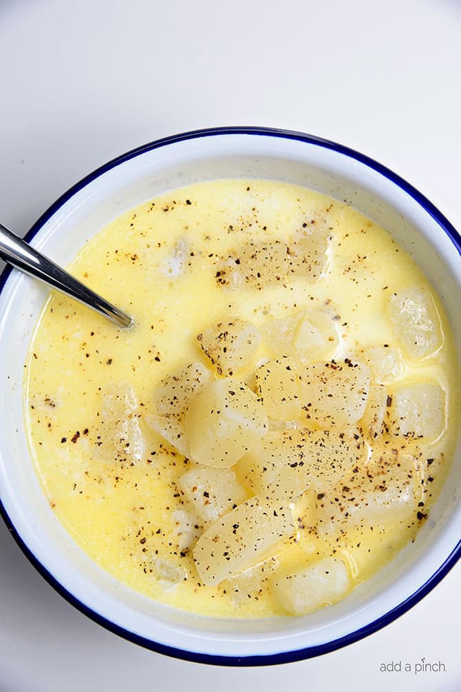 Bowl of old fashioned potato soup with a sprinkle of black pepper 