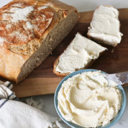 Homemade bread slathered with raw milk cream cheese spread