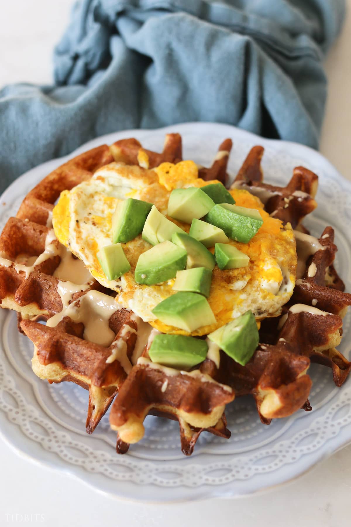 Quick dinner of waffles with eggs and avacado