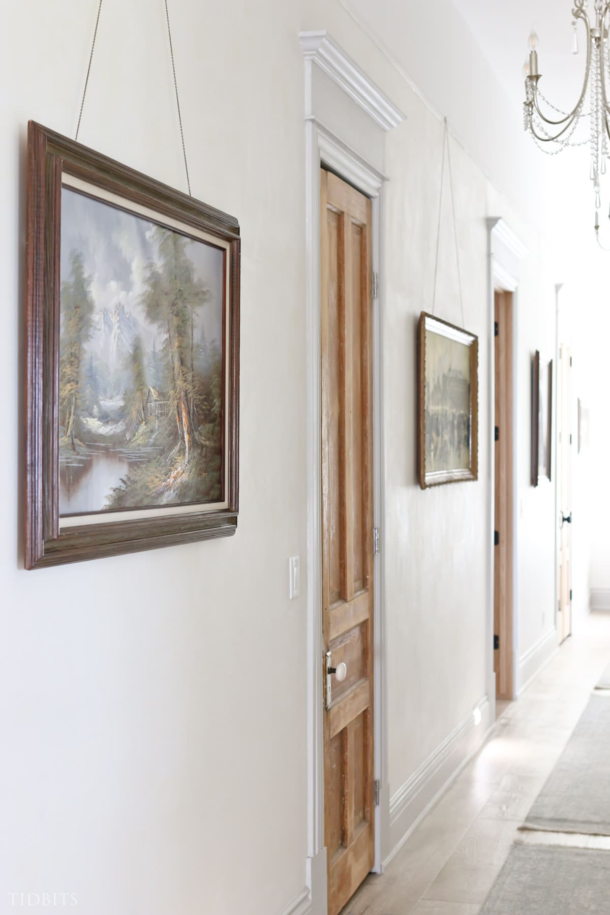Hallway with large wall art hung on the walls
