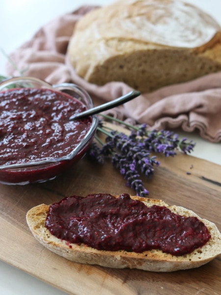Homemade jam on a table with bread and lavender