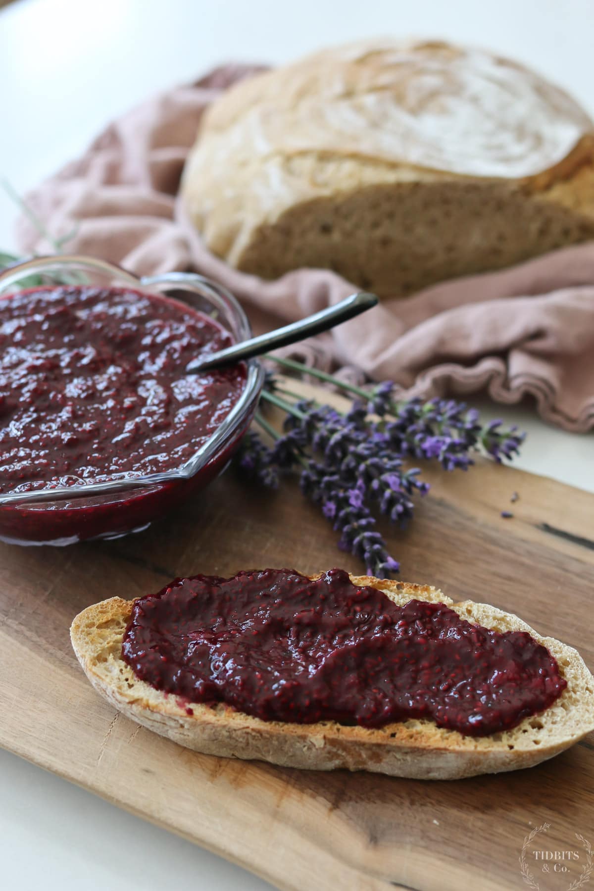 Homemade jam on a table with bread and lavender