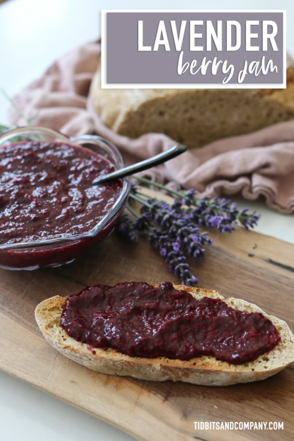 A bowl of jam and a slice of bread topped with lavender berry jam.