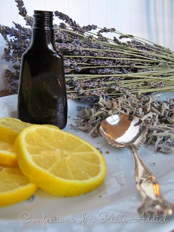 Lemon, lavender, a glass bottle and a spoon wait to be made in lemon and lavender simmering potpourri