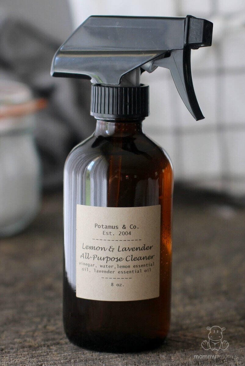 DIY all purpose cleaner with lemon and lavender in a brown spray bottle