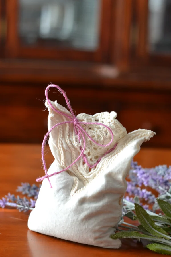 A hand sewn lavender sachet with a bow
