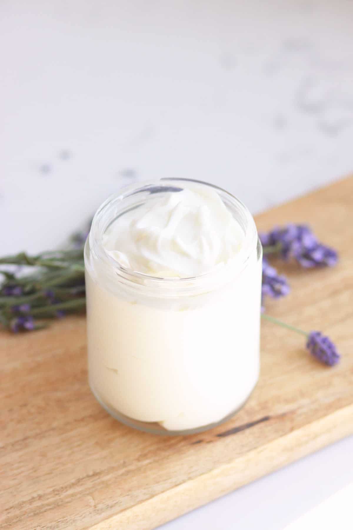 A glass jar of homemade lavender lotion