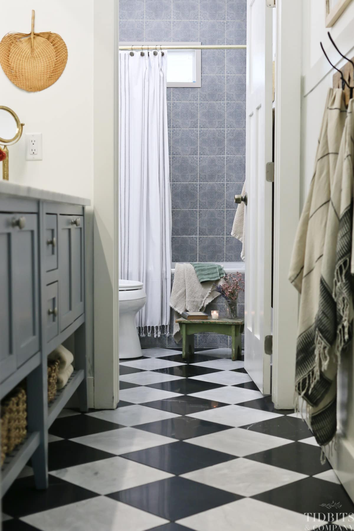 Black and white marble tile in a remodeled split bathroom 