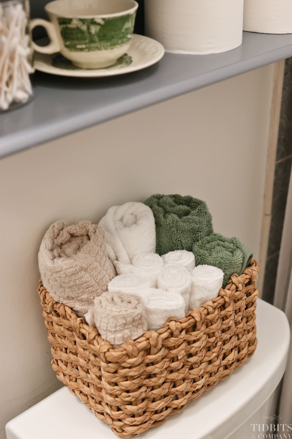 Rolled towels in a wicker basket