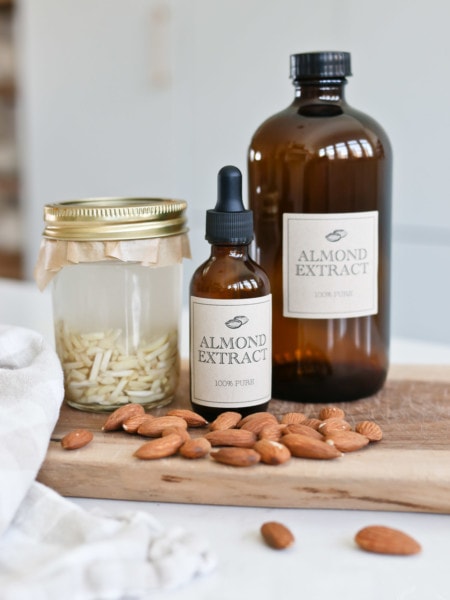 Glass bottles and jars of homemade almond extract