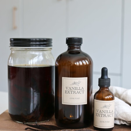 Glass jars of pure homemade vanilla extract