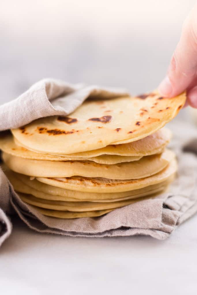 A stack of 4 ingredient chickpea flour tortillas made from garbanzo bean flour