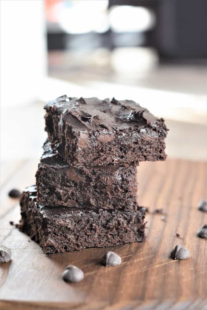 A stack of fudgy brownies made using a chickpea or garbanzo bean flour recipe