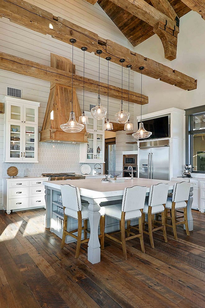 A barndominium interior kitchen featuring an island and vaulted ceiling