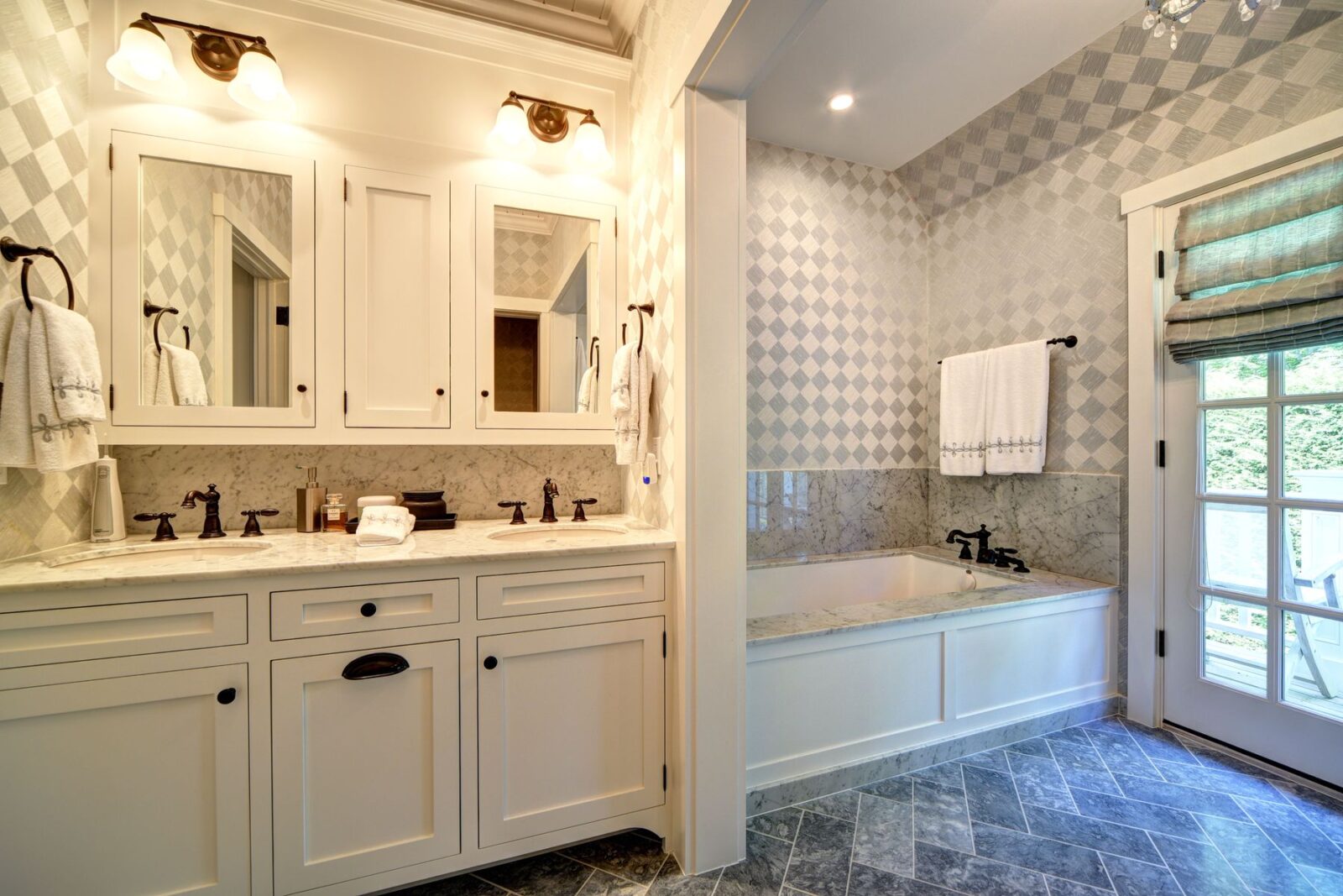 A pole barn bathroom with white vanity and a soaker tub